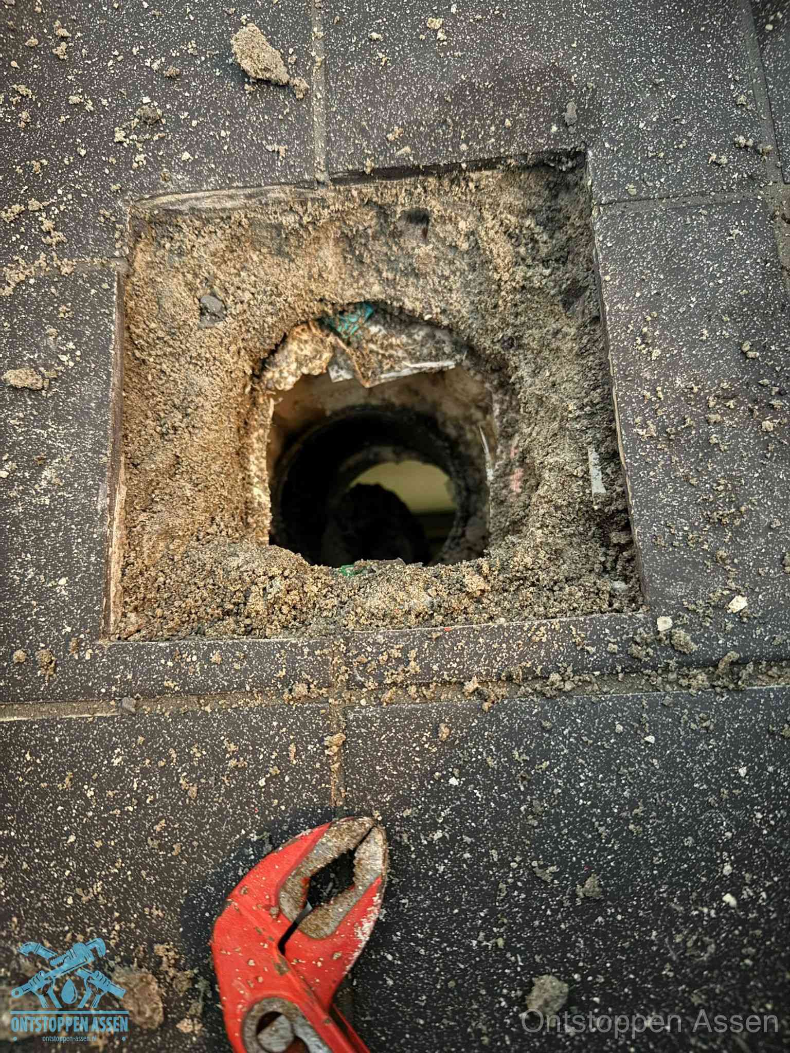 Rioolputje erfgrens eigendom in Assen